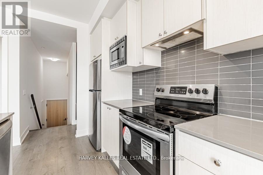 4 - 60 George Butchart Drive, Toronto, Ontario  M3K 0E1 - Photo 11 - W12399798