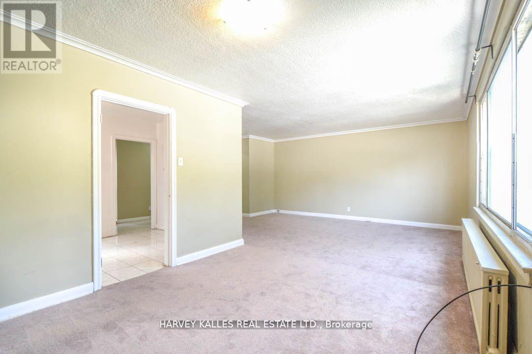 90 Trethewey Drive, Toronto, Ontario  M6M 4B4 - Photo 3 - W12501744